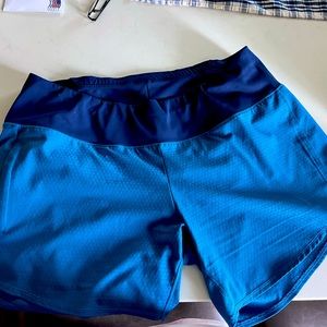 Oiselle long roga shorts. Size 8.